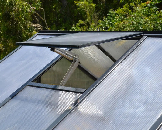 Open roof vent on a Palram-Canopia Glory greenhouse with twin-wall polycarbonate panels