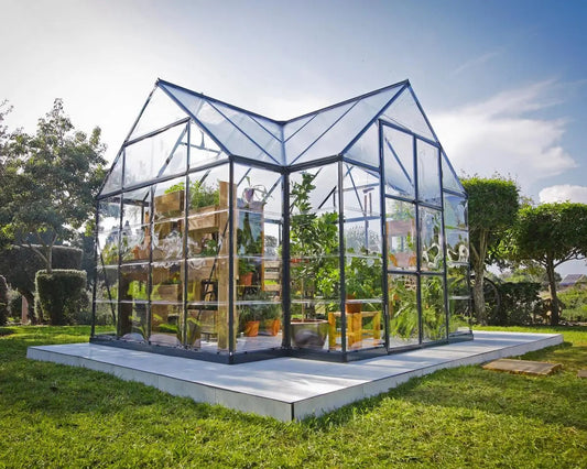 Palram-Canopia Victory Orangery greenhouse installed on a level concrete pad